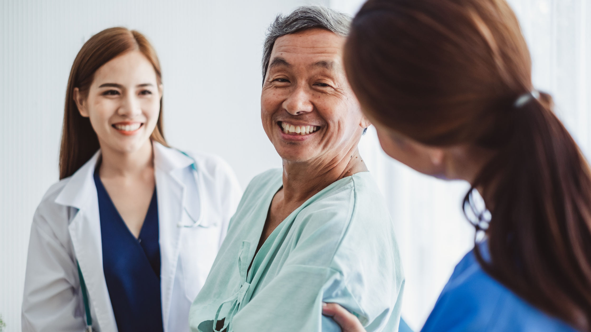 smiling-patient-with-nurses